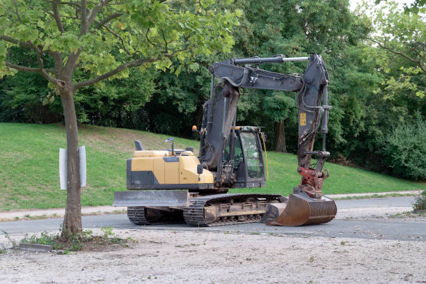 istock Single excavator stands in a park 1420779785