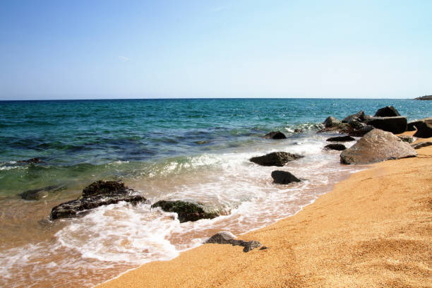 istock Waves, sea, beach, clear water. Stones under water. Spain. 1420781690