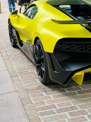 Yellow Lamborghini Huracan, red Ferrari F12 and white Mclaren 650s parked along the road. Miland, Norway. 04.06.2016