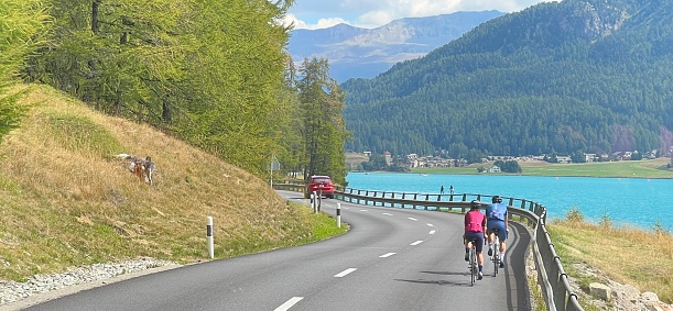 Silvaplana, Switzerland - August, 23 - 2022: Bicyclists at the Lake Silvaplana.