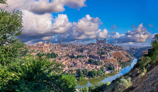 Panoramic view of the medieval center of the city of Toledo, Spain. It features the Cathedral and Alcazar of Toledo, Spain.