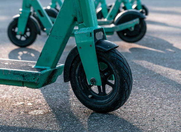 istock Green color electric scooters outdoors at sunny day. 1420787197
