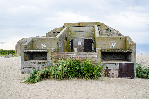 World war II Abandoned armory bunker on the beach of Cape May Point State Park during summer day