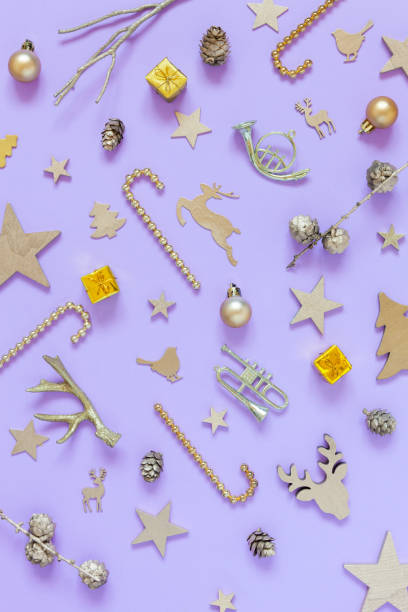 christmas and happy new year golden festive decorations on the lavender color background - confetti new years day new year christmas imagens e fotografias de stock