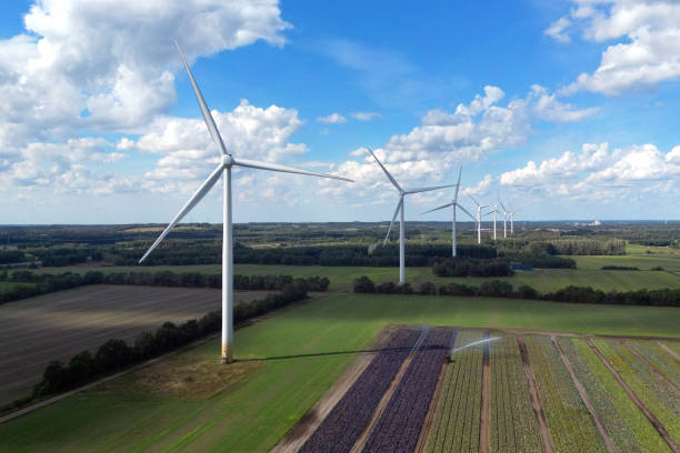 Windturbines Power generating windturbines on a sunny day in  Denmark alternative energy stock pictures, royalty-free photos & images