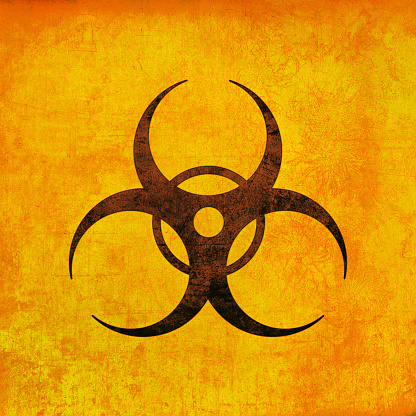 Biohazard sign, brown on yellow. Biological threat emblem, grunge textured