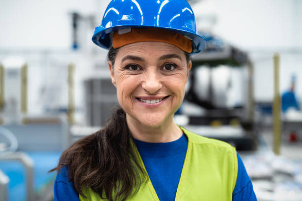 istock Engineer woman working inside robotic factory - Tech industry concept 1420791466