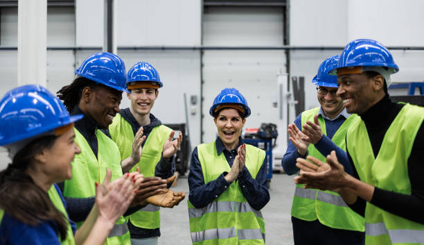 istock Team of multiracial engineers working in robotic factory - tech industrial concept 1420791543