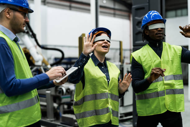 istock Team of engineers having simulation experience with futuristic virtual reality glasses inside robotic factory - Tech industry and metaverse concept 1420791646