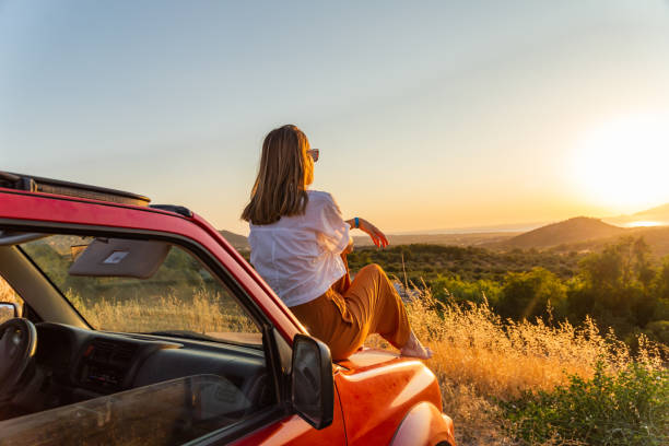 istock Young woman enjoying the sunset 1420794840