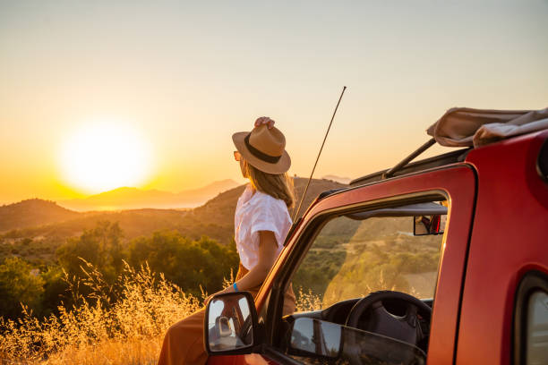 istock Young woman enjoying the sunset 1420794881