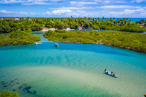 Aerial view of Pontal de Maracaipe mangrove and rafts sailing with turquoise water, Pernambuco.