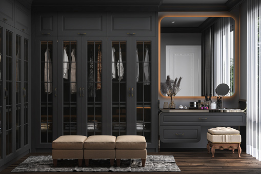 Modern luxury dressing room interior, walk in closet black wooden wardrobe with hidden lights on parquet floor. 3d rendering