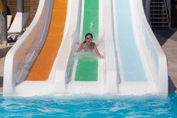 girl 10 years old on a water slide - 10 11 years cheerful happiness fun imagens e fotografias de stock