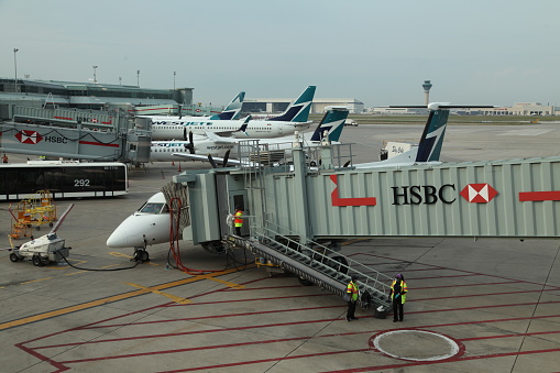 West Jest Airplanes at the gate at Toronto Canada's, Pearson International Airport on an overcast day