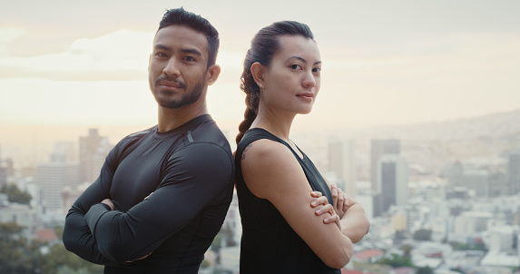 Fitness, health and sports couple with motivation for exercise, workout and cardio training for health goal in an urban city outdoor. Portrait of strong, wellness and healthy young athletes together