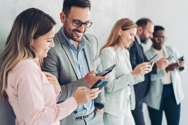 istock Business people with smart phones 1420800978