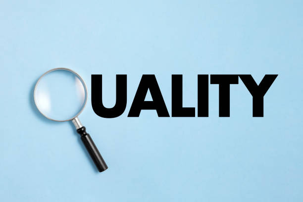 istock Quality Word with Magnifying Glass 1420801648