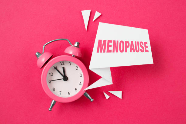 Alarm Clock and Word Menopause stock photo
