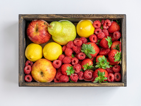 Variety of fruits in wooden crate