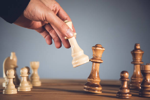 istock Male businessman plays chess in office 1420803818