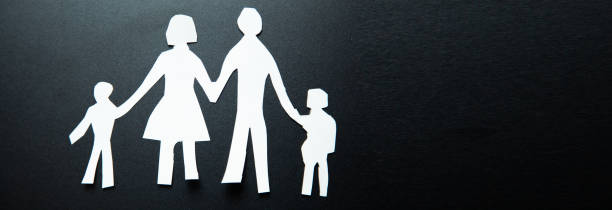 istock Paper chain family cut out from white paper 1420803830