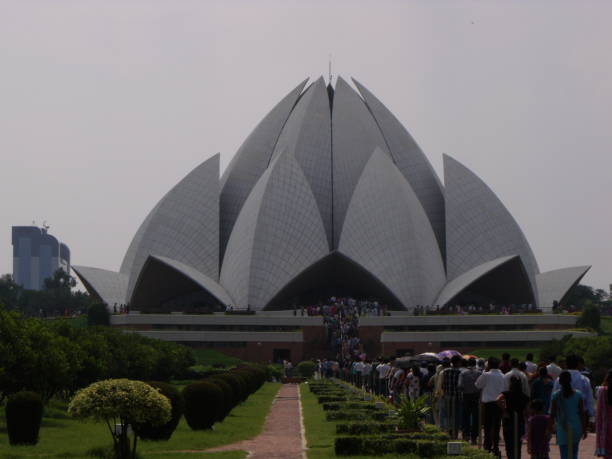 New Delhi, India, August 21, 2011: The Bahá'í House of Worship in Delhi, India, popularly known as the Lotus Temple, due to its flower shape with hundreds of worshipers on the way