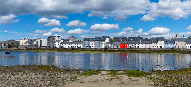 Galway, Ireland - 28 July, 2022: view of the River Corrib and the Long Walk Street with its colorful houses in downtown Galway