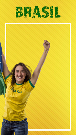 brazilian fan, woman celebrating on a yellow background. For social media.