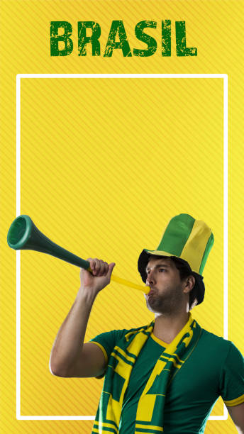 istock brazilian player, man celebrating on a yellow background. 1420809332