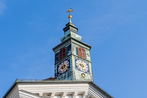 Picture of impressive clock tower of Ljubljana city hall under the blue sky