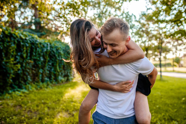 istock Loving boyfriend carrying his girlfriend on his back 1420815736
