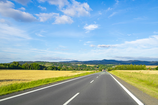 Empty freeway goes into the distance on a summer day