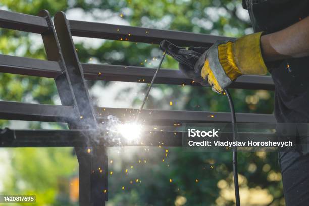 Welding Metal By Electric Arc Welding Closeup Stock Photo - Download Image Now - Welder, Repairing, Welding