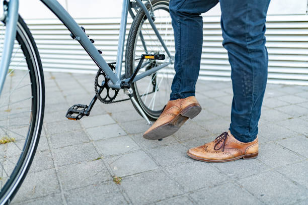 istock A cropped view of a young man leaving a bicycle 1420820555