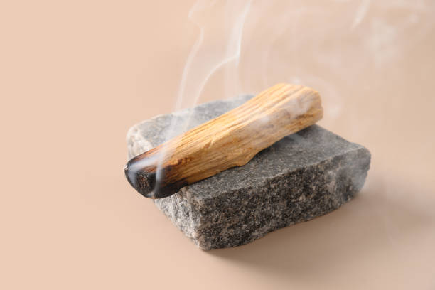 istock Palo Santo stick incense burning on stone. 1420827365