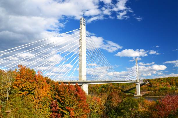 A dynamic autumn sky provides a dramatic background for the Penobscot Narrows Bridge & Observatory in Maine.