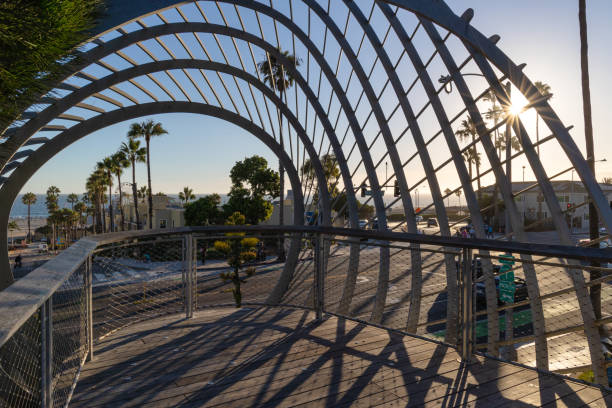 Santa Monica, CA - August 15 2022:  Santa Monica Pier in the distance viewed through artwork with a lens flare