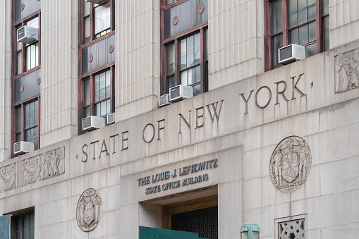 New York City, USA - August 22, 2022: State of New York sign on the Louis J. Lefkowitz State Office Building in New York City, USA.  The Lefkowitz Building is home to the Manhattan Marriage Bureau.
