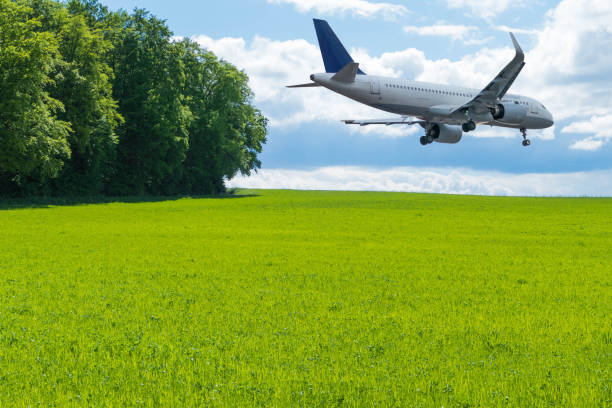istock Plane flying through green Landscape 1420838755