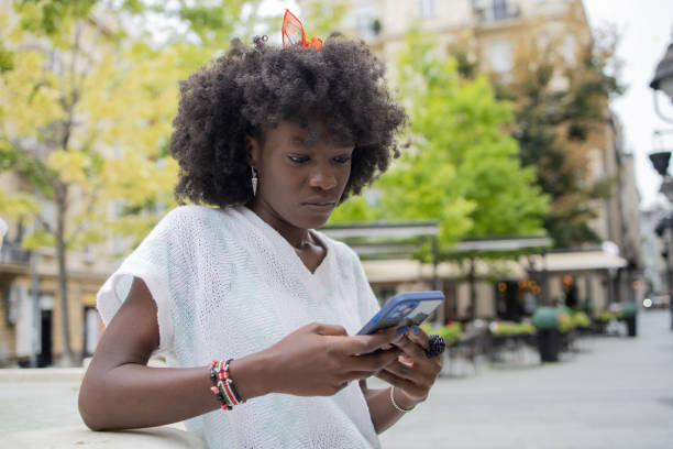 istock Happy young woman using phone 1420840788