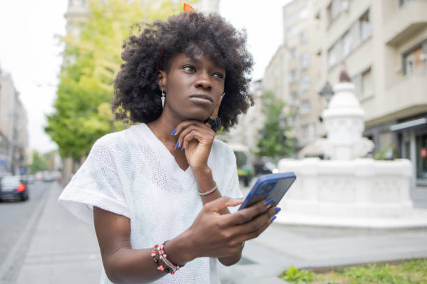 istock Happy woman using phone 1420840833