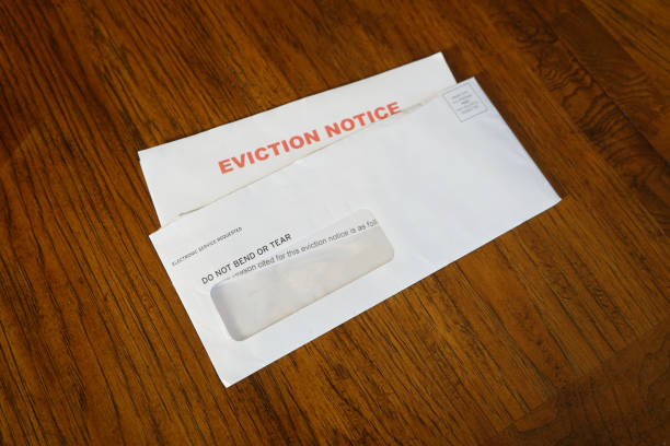 istock Close-up Of An Eviction Notice In Envelope on Desk left angled 1420844080