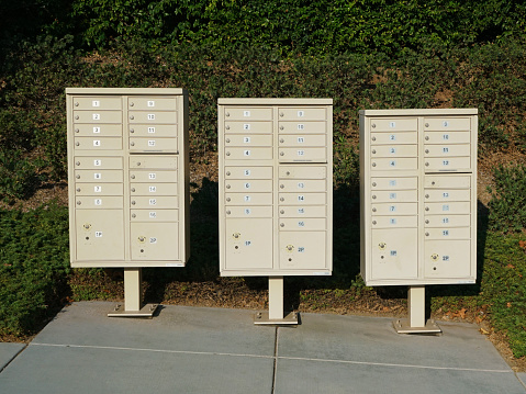 A Group of three street postal mail boxes