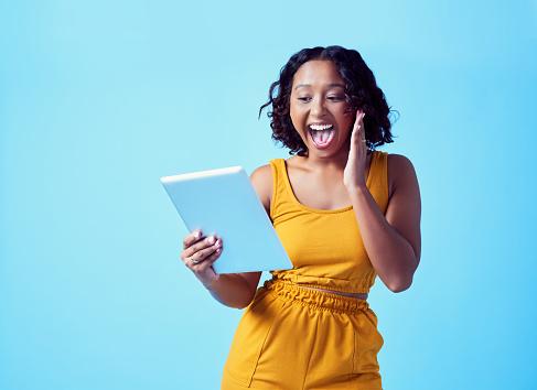 Wow, success and woman happy on tablet after receiving news or winning with mockup. Winner, shocked and surprised or omg female on app, digital tech or technology and social media mock up background.
