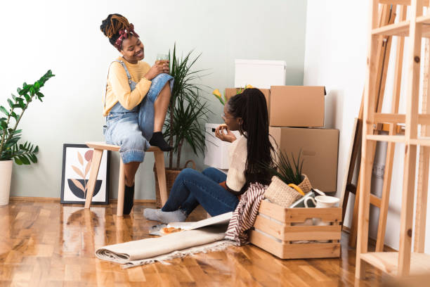 istock Two Afro girls eating pizza and resting while moving in 1420850744
