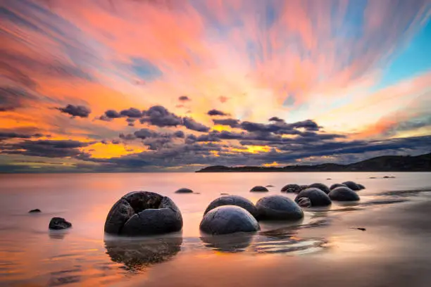 Photo of Moeraki Boulders beach at sunrise, New Zealand