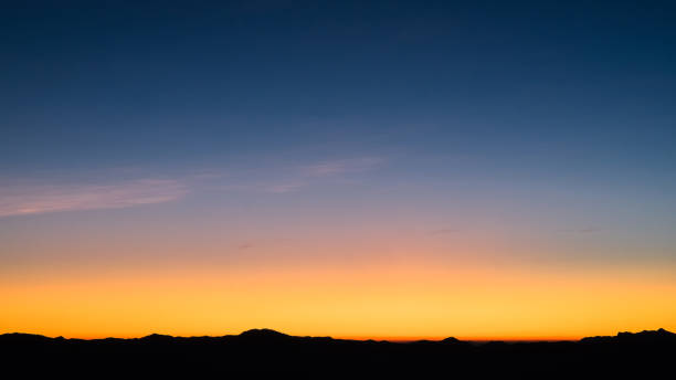 istock Beautiful bright cloud sky with light for heaven religion background. Sunrise and twilight or sunset cloudscape is orange and blue colours in summer nature. 1420865123