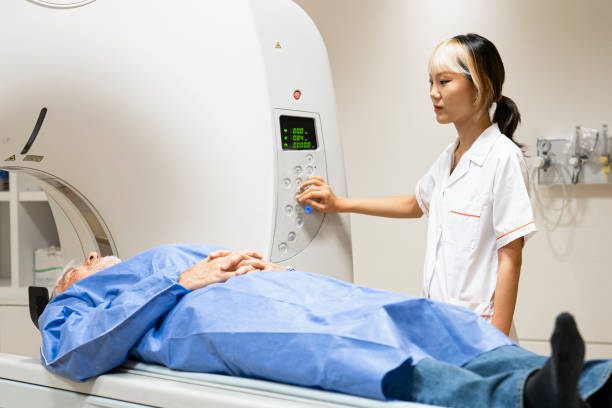 istock Young female Asian-American technician operating an MRI scanner 1420879564