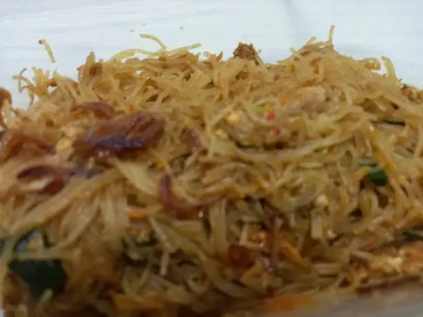 Photo of Vermicelli fried or called bihun goreng served in a plastic box with top view photo